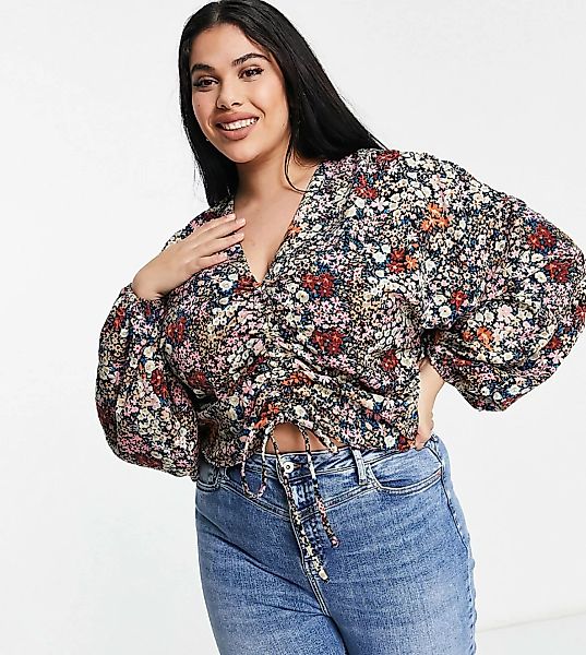 Vero Moda Curve – Bluse mit V-Ausschnitt und Blümchenmuster in Rosa günstig online kaufen