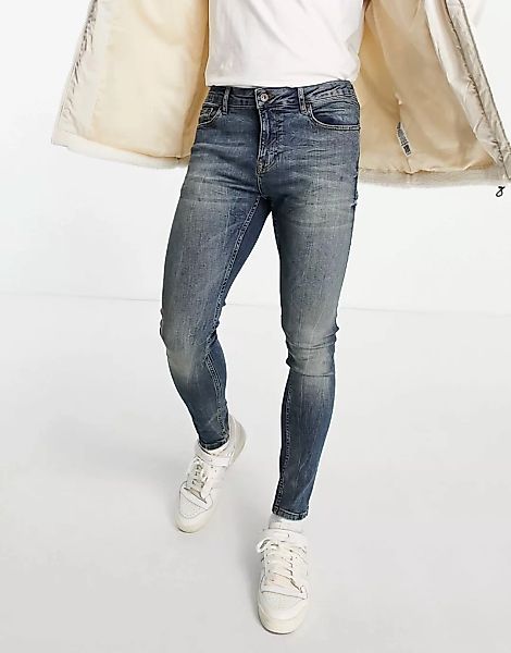 Topman – Hautenge Jeans in getönter, dunkler Waschung-Blau günstig online kaufen