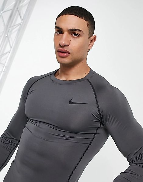 Nike – Pro Training – Langärmliges, leichtes Oberteil in Grau günstig online kaufen