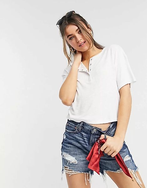 ASOS DESIGN – Kurzes, kastenförmiges T-Shirt in Weiß mit Druckknöpfen vorne günstig online kaufen