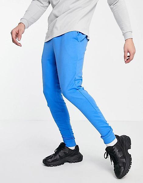 ASOS DESIGN – Leichte Jogginghose mit Bio-Baumwolle in Blau mit engem Schni günstig online kaufen