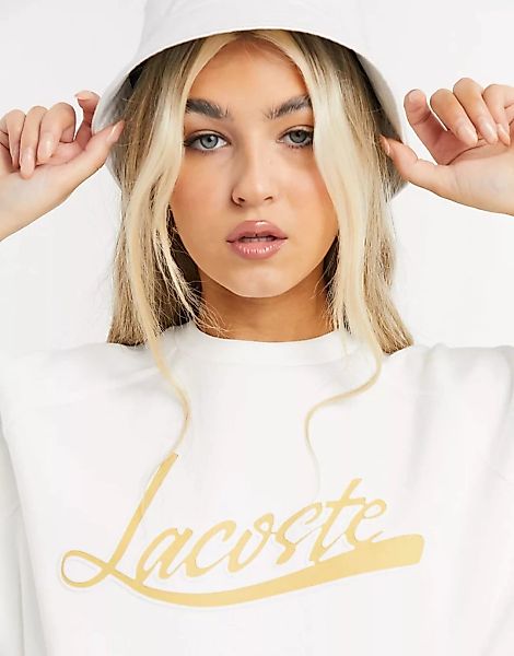 Lacoste – Sweatshirt in Creme mit Logo auf der Vorderseite-Weiß günstig online kaufen