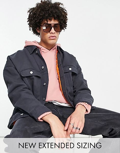 ASOS DESIGN – Oversize-Jeansjacke in Schwarz mit kontrastierendem Futter günstig online kaufen
