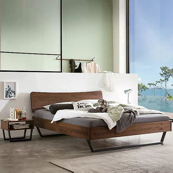 Massivholz Bett mit Bügelgestell aus Nussbaum Massivholz Stahl günstig online kaufen