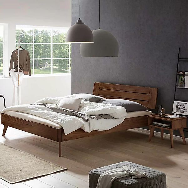 Nussbaumholz Bett 140x200 cm in modernem Design auch mit Nachtkommode günstig online kaufen