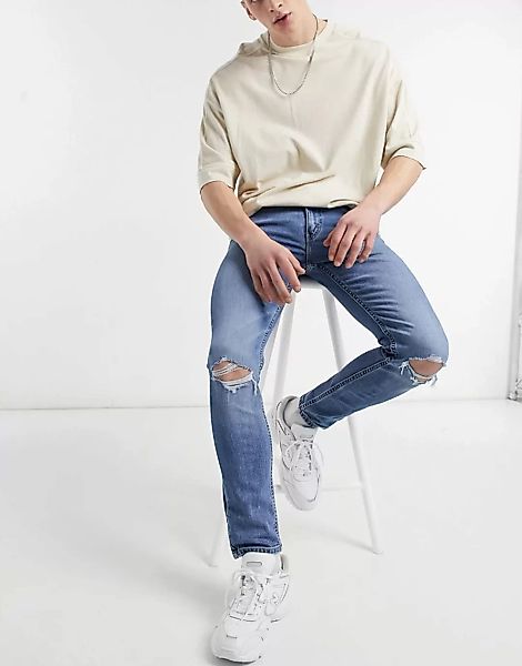 Levi's – Youth 519 Hi-Ball – Superenge Jeans in Used-Optik und mittlerer Wo günstig online kaufen
