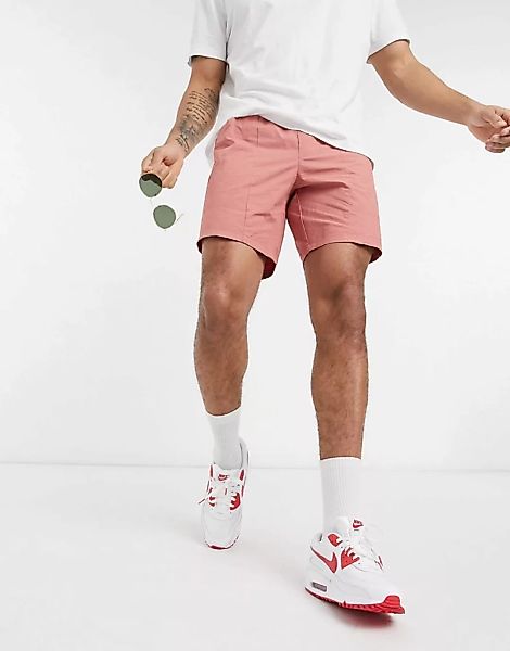 ASOS DESIGN – Schmale Shorts mit aufgesetzten Taschen in verwaschenem Rot günstig online kaufen