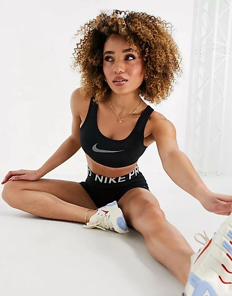 Nike Training – Icon Clash – Sport-BH in Schwarz mit mittlerer Stützfunktio günstig online kaufen