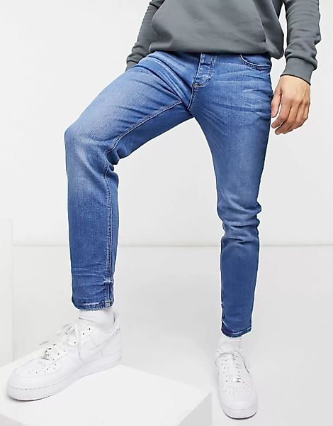 River Island – Eng geschnittene Jeans in Blau günstig online kaufen