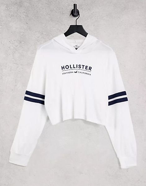 Hollister – Langärmliger Kapuzenpullover in Weiß mit Logo am Ärmel günstig online kaufen