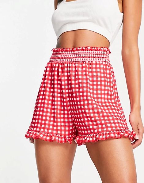 ASOS DESIGN – Schwingende Shorts in Rot mit Rüschensaum und Vichy-Karomuste günstig online kaufen