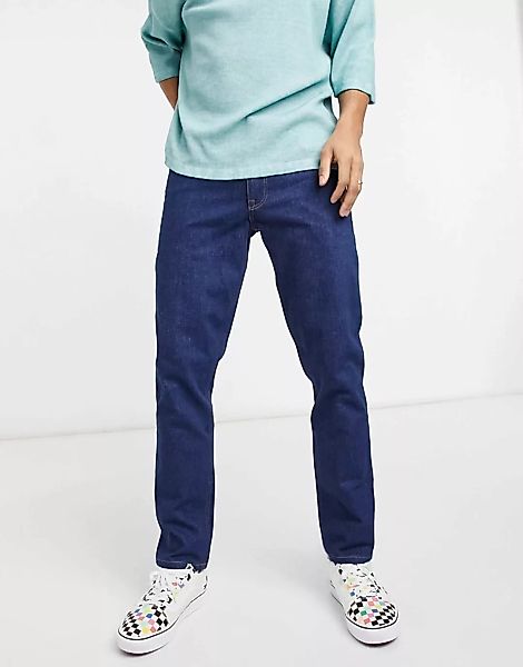 ASOS DESIGN – Schmale Stretch-Jeans in Indigo-Waschung im 70er-Style-Blau günstig online kaufen
