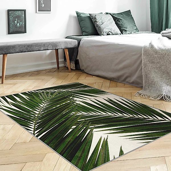 Teppich Blick durch grüne Palmenblätter günstig online kaufen