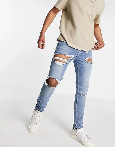 ASOS DESIGN – Skinny-Jeans in mittelblauer Vintage-Waschung mit Zierrissen günstig online kaufen
