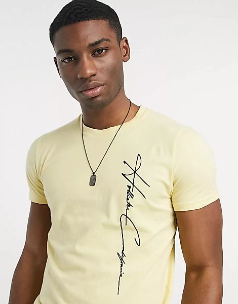 Hollister – Goldfarbenes T-Shirt mit großem, senkrechten Logoschriftzug günstig online kaufen