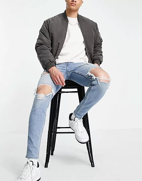 Hollister – Superenge Jeans in heller Waschung mit großen Rissen am Knie un günstig online kaufen