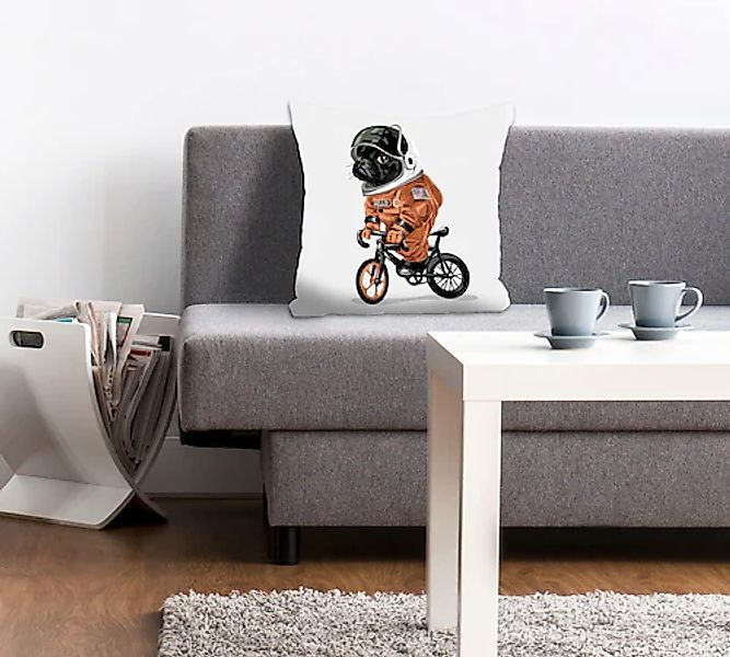 queence Dekokissen "Spacedog" mit einem fahrradfahrenden Astronauten-Hund günstig online kaufen