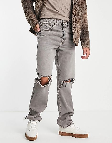 ASOS DESIGN – Grau gefärbte, gerade geschnittene Jeans mit Rissen an den Kn günstig online kaufen