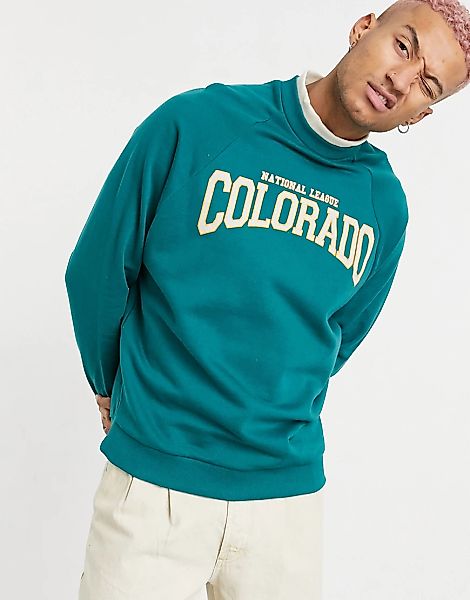 ASOS DESIGN – Oversize-Sweatshirt in Grün mit „Colorado“-Cityprint günstig online kaufen