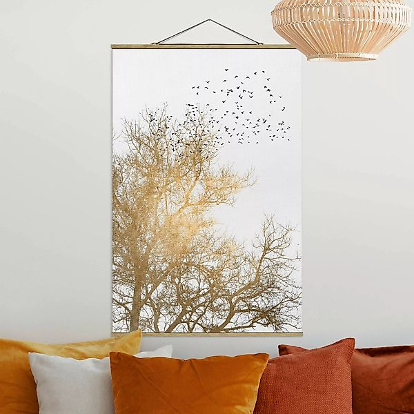 Stoffbild mit Posterleisten Vogelschwarm vor goldenem Baum günstig online kaufen