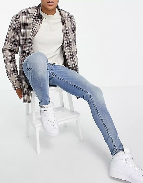 Topman – Hautenge Jeans aus Bio-Baumwollmix in heller Waschung-Blau günstig online kaufen