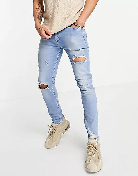 ASOS DESIGN – Enge Jeans in Vintage-Mittelblau im Used-Look mit zerrissenen günstig online kaufen