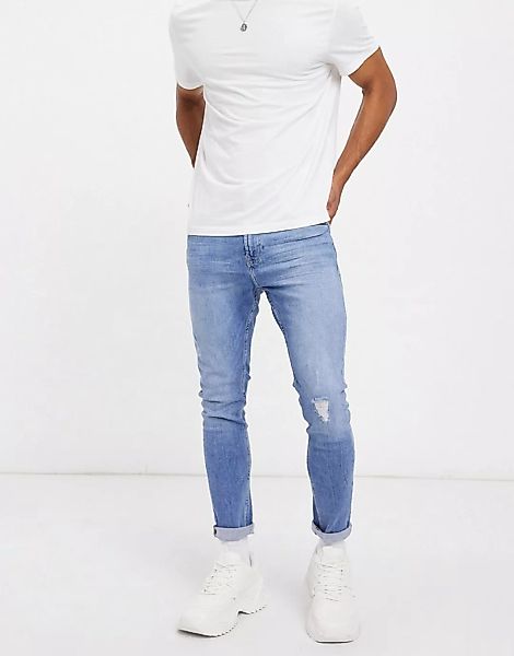 Bershka – Superenge Jeans mit Abnutzungseffekten, in Mittelblau günstig online kaufen