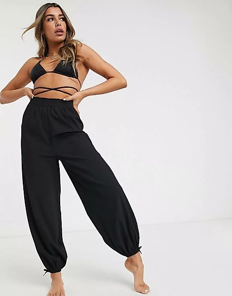 ASOS DESIGN – Schwarze Crinkle-Strandhose im Haremsstil günstig online kaufen