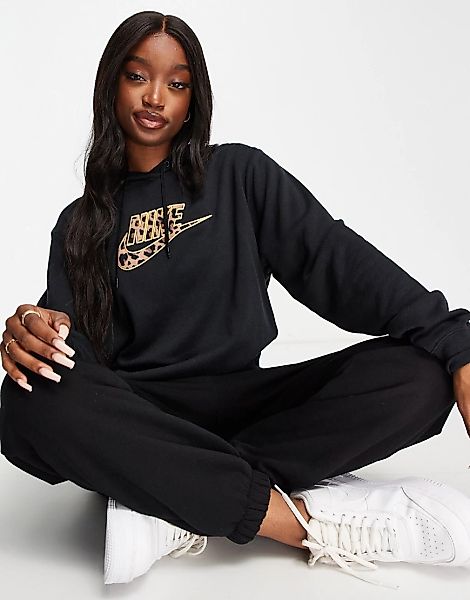 Nike – Futura – Kapuzenpullover in Schwarz mit Swoosh-Logo und Leopardenmus günstig online kaufen