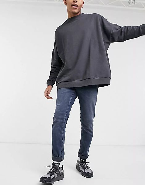 ASOS DESIGN – Schmal geschnittene Stretch-Jeans in dunklem Blau günstig online kaufen