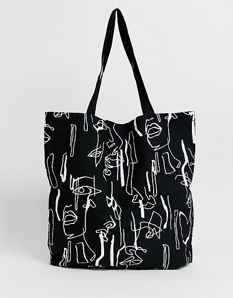 ASOS DESIGN – Große Shopper-Tasche aus Bio-Baumwolle mit abstraktem Gesicht günstig online kaufen
