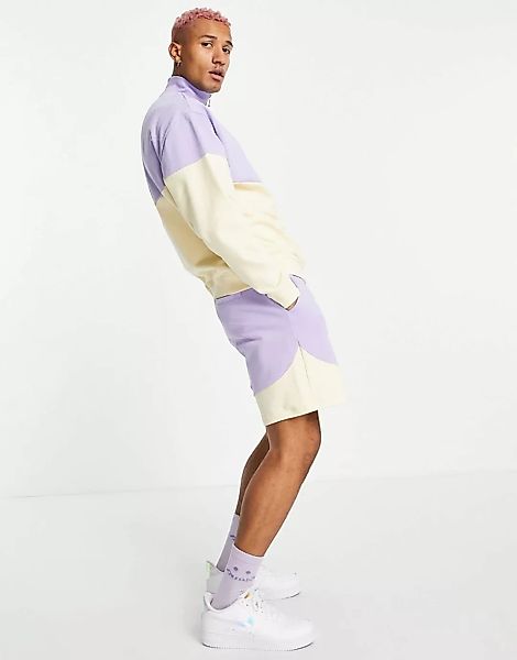 ASOS DESIGN – Oversize-Shorts aus Jersey mit Farbblockdesign in Pastelltöne günstig online kaufen