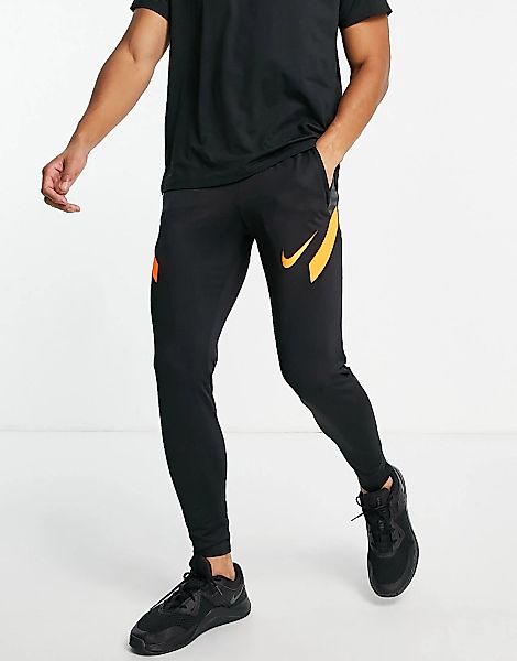 Nike Football – Strike – Jogginghose in Schwarz und Orange günstig online kaufen