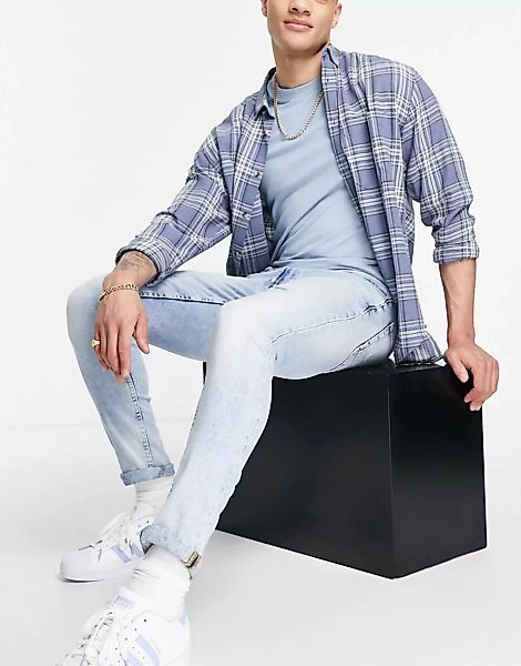 Burton ‑ Enge Jeans mit Rissen und Ausbesserungen in Mittelblau günstig online kaufen