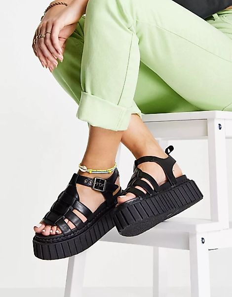 Lamoda – Klobige Sandalen mit flacher Plateausohle in Schwarz günstig online kaufen