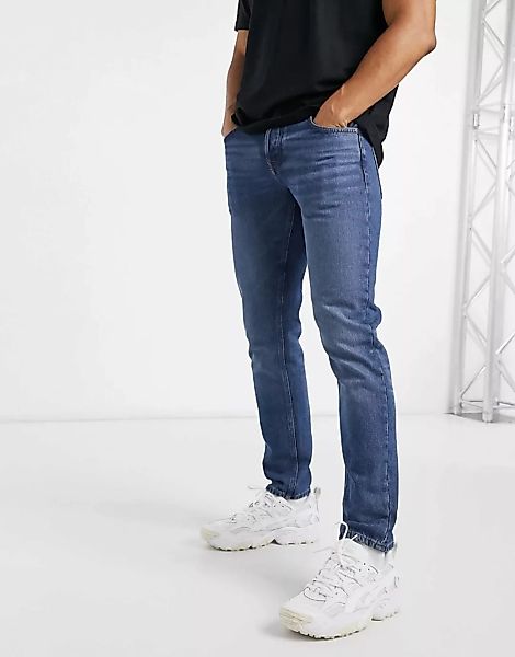 ASOS DESIGN – Eng geschnittene Jeans aus Bio-Baumwollmix in dunkelblauer Wa günstig online kaufen