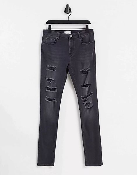 ASOS DESIGN – Enge Jeans in verwaschenem Schwarz mit starken Rissen günstig online kaufen