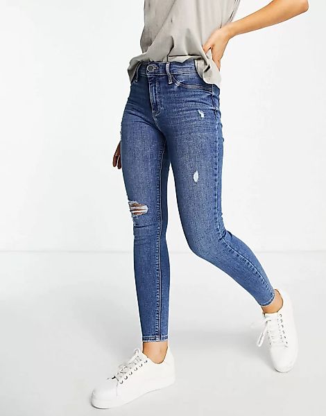 River Island – Eng geschnittene, zerrissene Jeans mit mittelhohem Bund in D günstig online kaufen