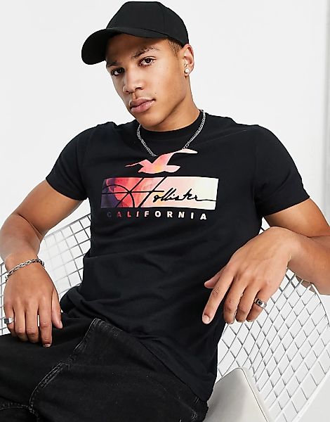 Hollister – T-Shirt in Schwarz mit Batikmuster-Logo günstig online kaufen