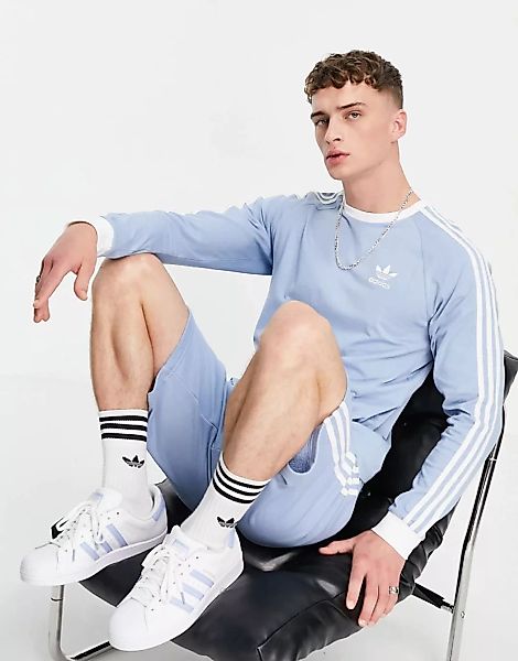 adidas Originals – adicolor – Langärmliges Shirt mit drei Streifen in Hellb günstig online kaufen