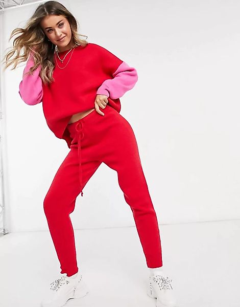 Never Fully Dressed – Gestrickte Jogginghose mit Taillenschnürung in Rot, K günstig online kaufen