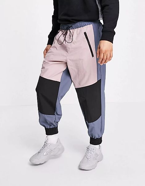 ASOS DESIGN – Oversized-Jogginghose aus Nylon mit Einsätzen-Mehrfarbig günstig online kaufen