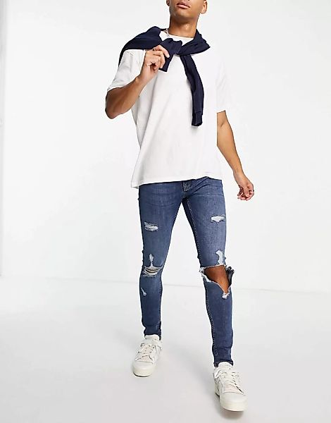 Topman – Hautenge Jeans mit Zierrissen und mittlerer Waschung-Blau günstig online kaufen