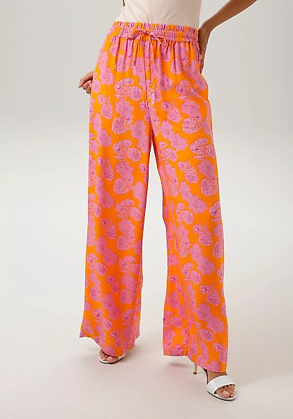 Aniston CASUAL Schlupfhose, mit trendfarbenem Blumendruck- jedes Teil ein U günstig online kaufen