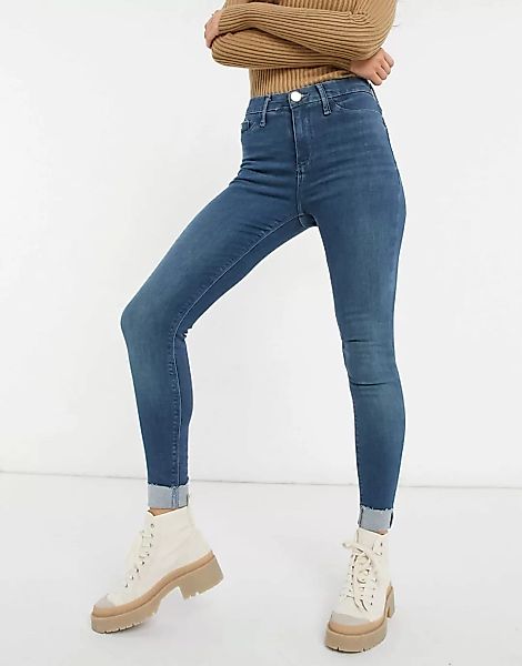 River Island – Molly – Eng geschnittene Jeans mit Umschlag in verwaschenem günstig online kaufen