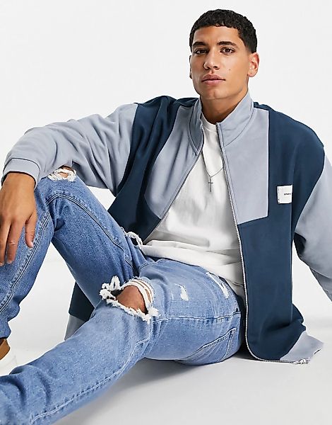 ASOS – Unrvlld Spply – Oversize-Jacke aus Polarfleece in Blau mit Stehkrage günstig online kaufen