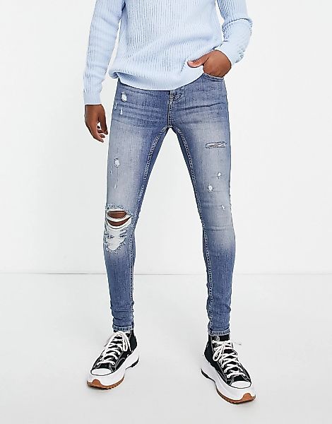 Topman – Hautenge Jeans mit Rissen in mittlerer Waschung-Blau günstig online kaufen