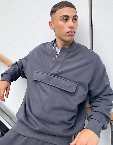 ASOS DESIGN – Oversize-Sweatshirt in verwaschenem Schwarz mit geripptem Kra günstig online kaufen