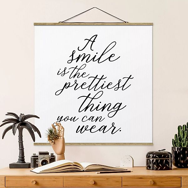 Stoffbild Spruch mit Posterleisten - Quadrat A smile is the prettiest thing günstig online kaufen