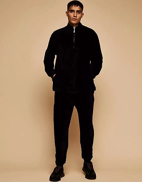 Topman – Sweatshirt aus Cord in Schwarz mit halblangem Reißverschluss, Komb günstig online kaufen